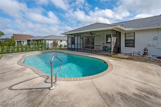 view of swimming pool featuring ceiling fan and a patio area