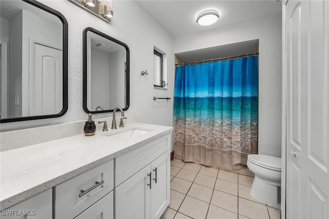 bathroom with walk in shower, vanity, toilet, and tile patterned flooring