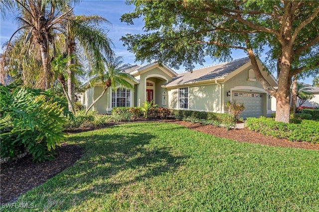 single story home with an attached garage, a front lawn, and stucco siding