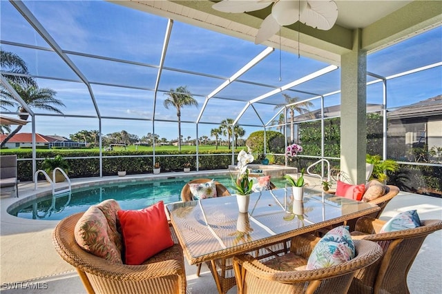 exterior space with a pool with connected hot tub, a lanai, a patio, and ceiling fan