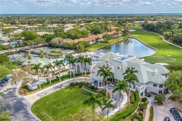 aerial view featuring golf course view, a water view, and a residential view