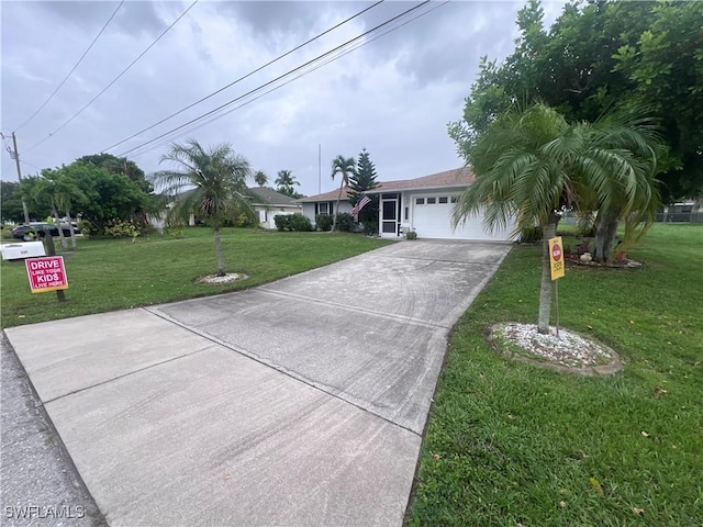 single story home with a garage and a front yard