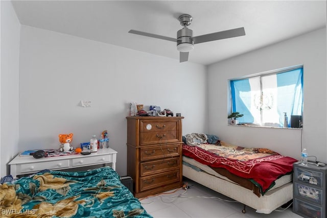 tiled bedroom with ceiling fan