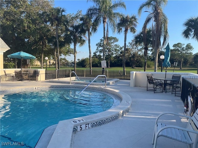 view of swimming pool featuring a patio