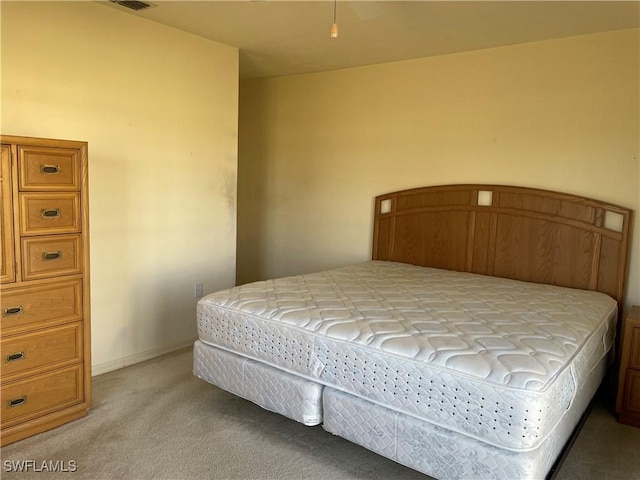 bedroom with light carpet