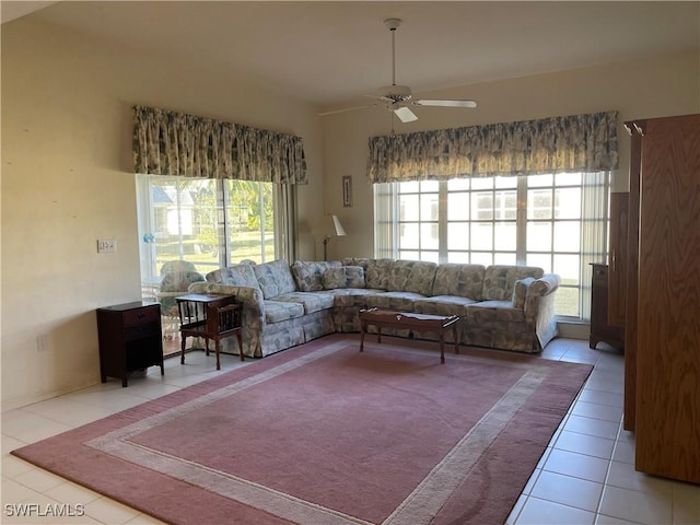 living room featuring light tile patterned floors and ceiling fan