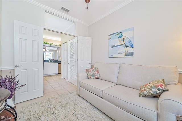 tiled living room featuring crown molding and ceiling fan