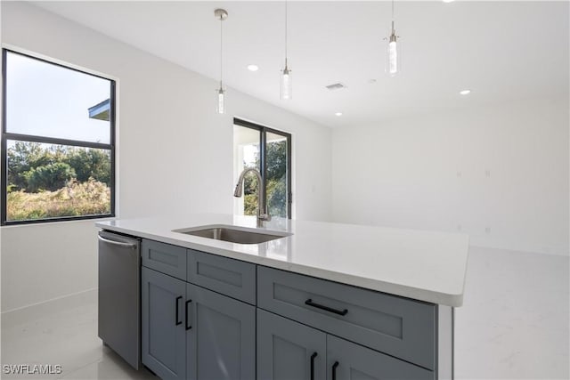 kitchen featuring decorative light fixtures, dishwasher, sink, and gray cabinetry