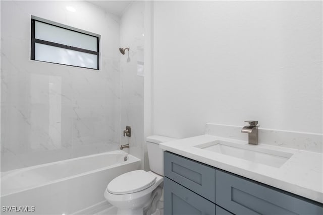 full bathroom featuring vanity, toilet, and tiled shower / bath