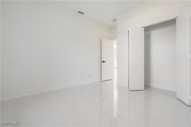 unfurnished bedroom featuring a closet