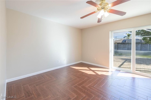 empty room with parquet flooring and ceiling fan