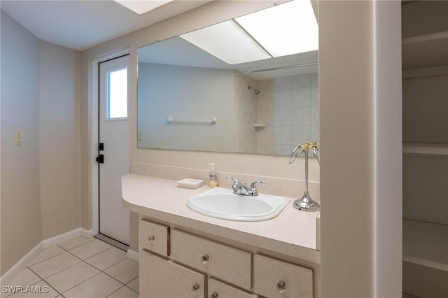 bathroom with tile patterned flooring and vanity