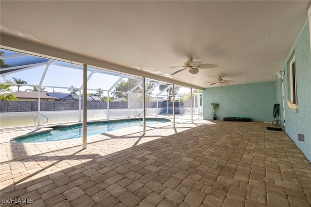 view of swimming pool with a lanai, a patio, and ceiling fan