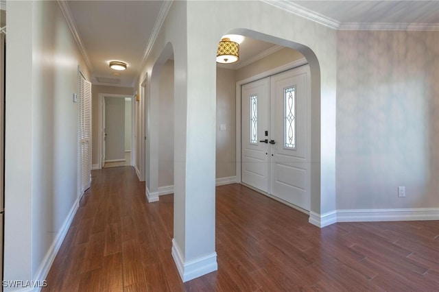 entrance foyer featuring crown molding and dark hardwood / wood-style flooring