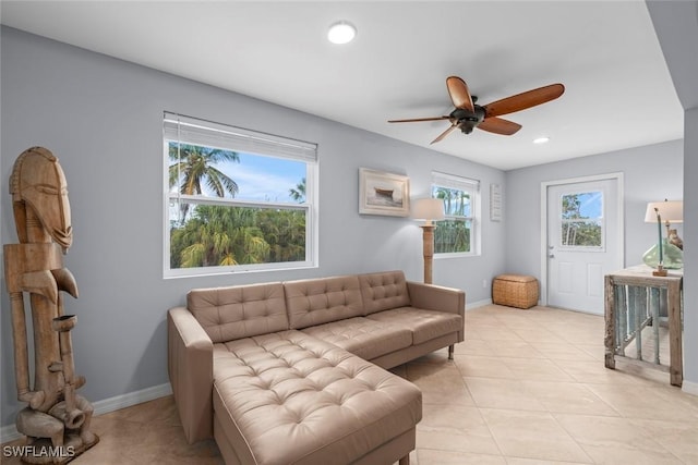 tiled living room featuring ceiling fan