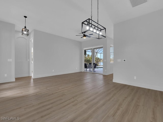 unfurnished living room featuring ceiling fan and light wood-type flooring