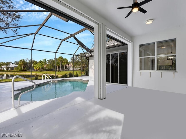 view of pool featuring a lanai, ceiling fan, and a patio area