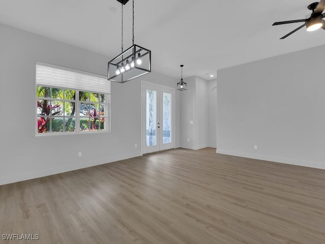 interior space with french doors and ceiling fan