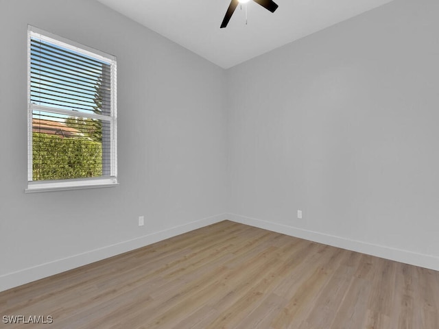 spare room featuring ceiling fan and light hardwood / wood-style flooring