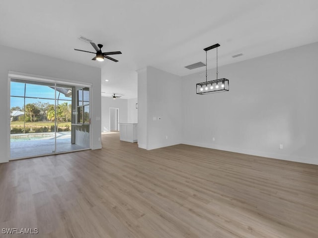 unfurnished living room with ceiling fan and light hardwood / wood-style flooring