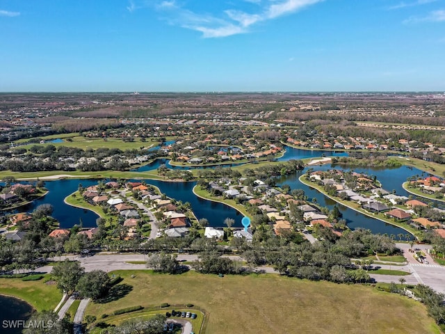 birds eye view of property featuring a water view