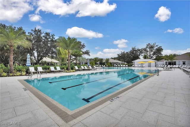 view of swimming pool with a patio area