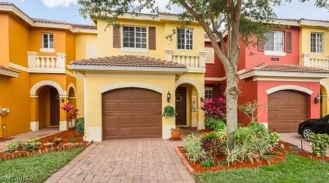 mediterranean / spanish home featuring a garage