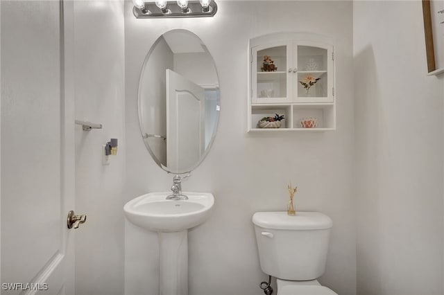 bathroom featuring sink and toilet