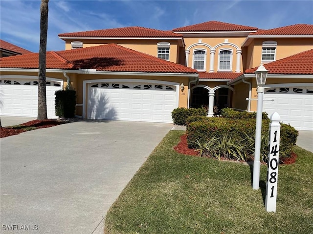 mediterranean / spanish-style home with a garage