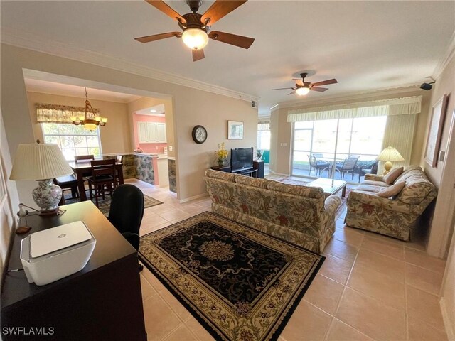 tiled living room featuring ornamental molding, ceiling fan with notable chandelier, and plenty of natural light