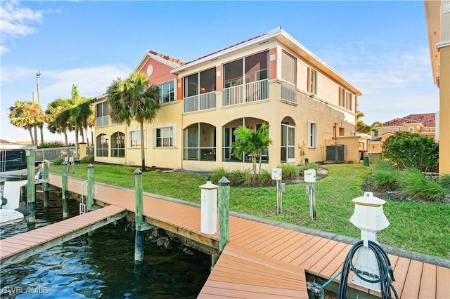 174 Shadroe Cove Cir Unit 1003, Cape Coral, FL 33991 - dock area featuring cooling unit, a lawn, and a water view