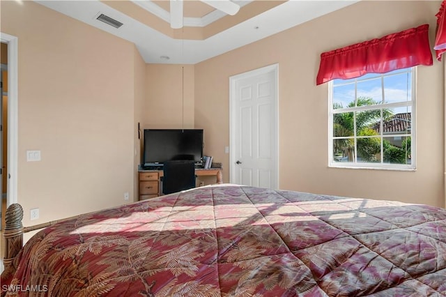 bedroom featuring a raised ceiling