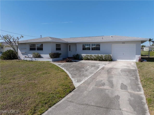 ranch-style house with a garage and a front yard