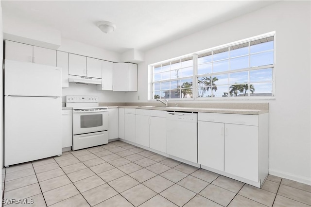 kitchen with white cabinetry, sink, and white appliances