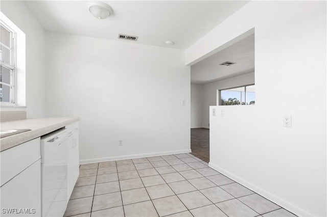 interior space featuring light tile patterned floors