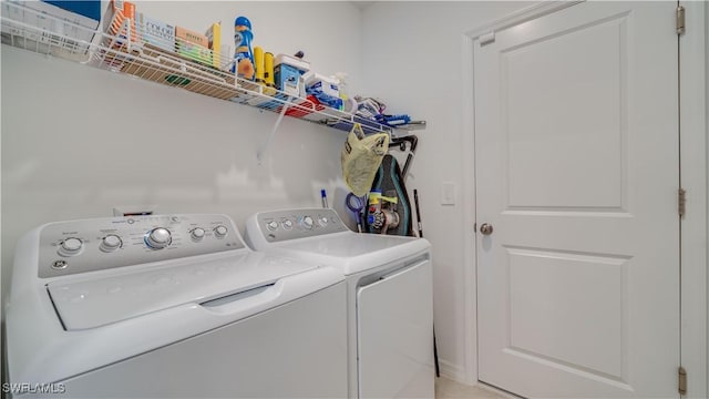 clothes washing area with washer and dryer