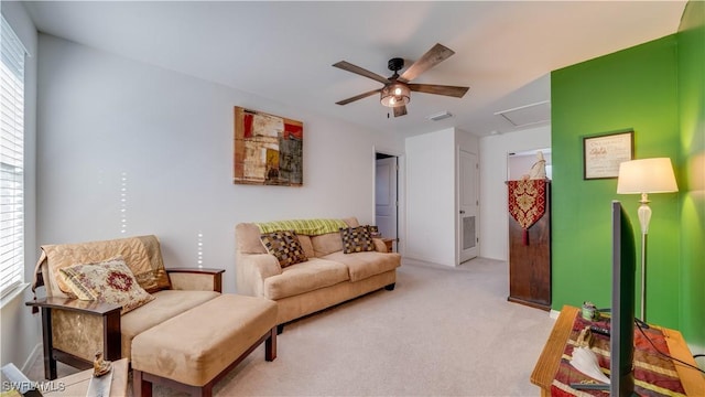 living room with light carpet and ceiling fan