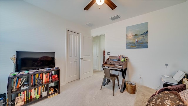 interior space featuring light colored carpet and ceiling fan