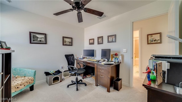 office featuring ceiling fan and light carpet