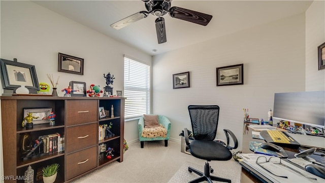 office featuring ceiling fan and light carpet