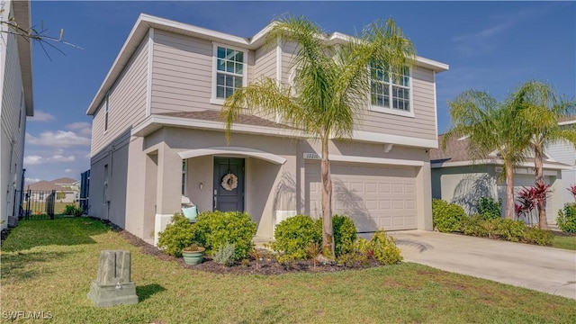 view of front facade with a garage and a front yard