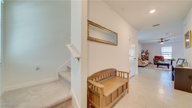 hallway featuring light tile patterned floors