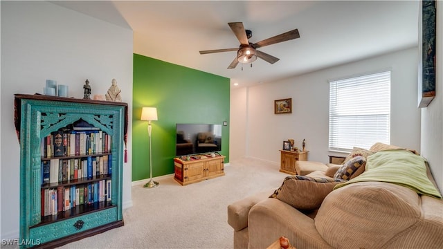 carpeted living room featuring ceiling fan