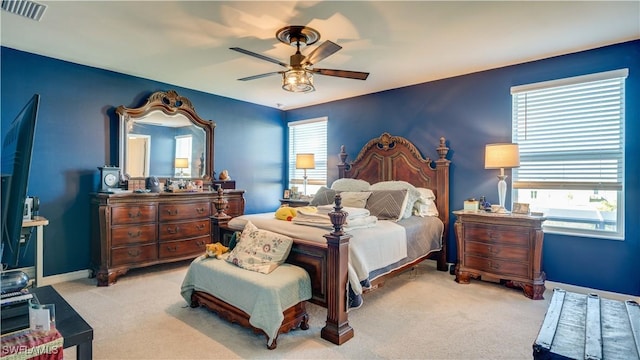 carpeted bedroom with ceiling fan