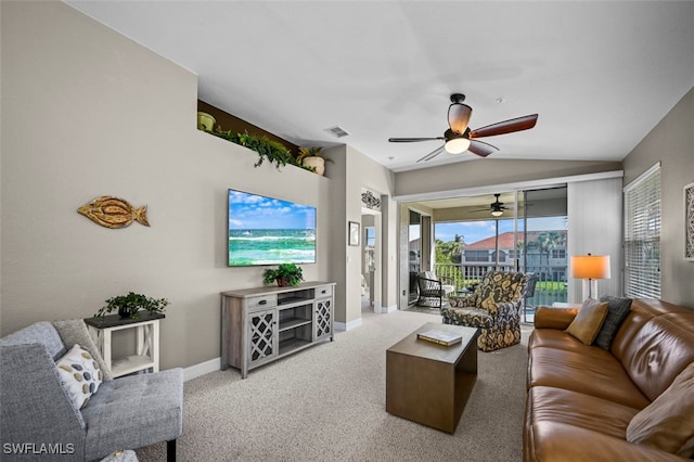 carpeted living room featuring vaulted ceiling and ceiling fan