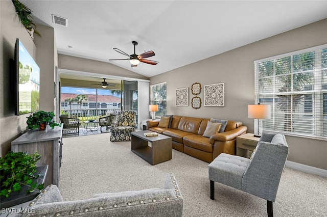 living room with vaulted ceiling, carpet floors, and ceiling fan