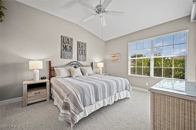 carpeted bedroom featuring lofted ceiling and ceiling fan