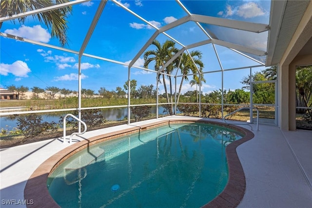 view of pool with a water view, a patio area, and a lanai