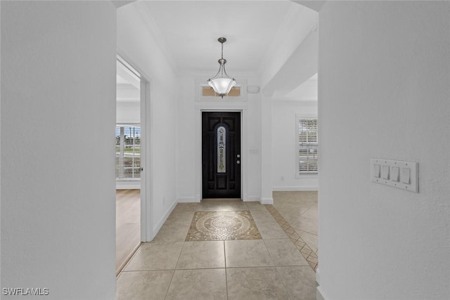 tiled entryway with crown molding