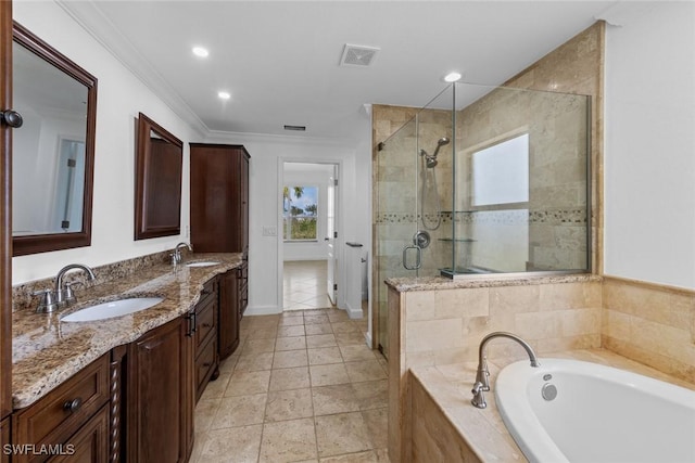 bathroom with crown molding, vanity, and plus walk in shower